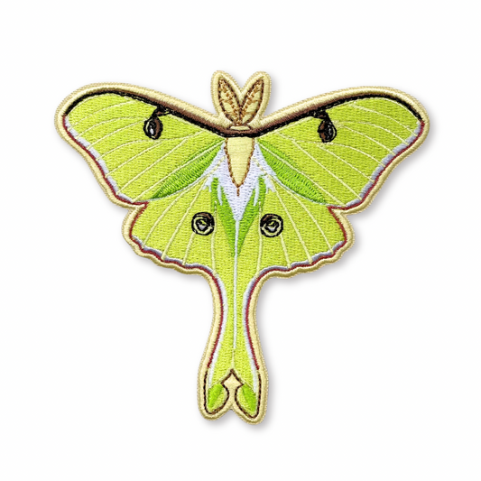 Embroidered patch of a luna moth on a white background
