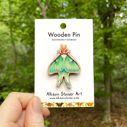A wooden pin of a luna moth