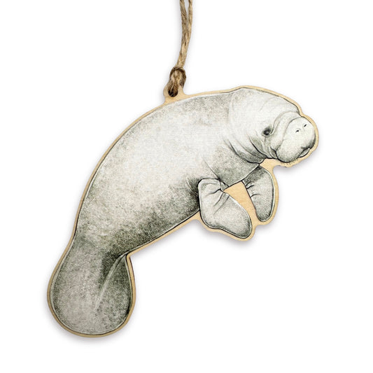 A wooden ornament of a manatee