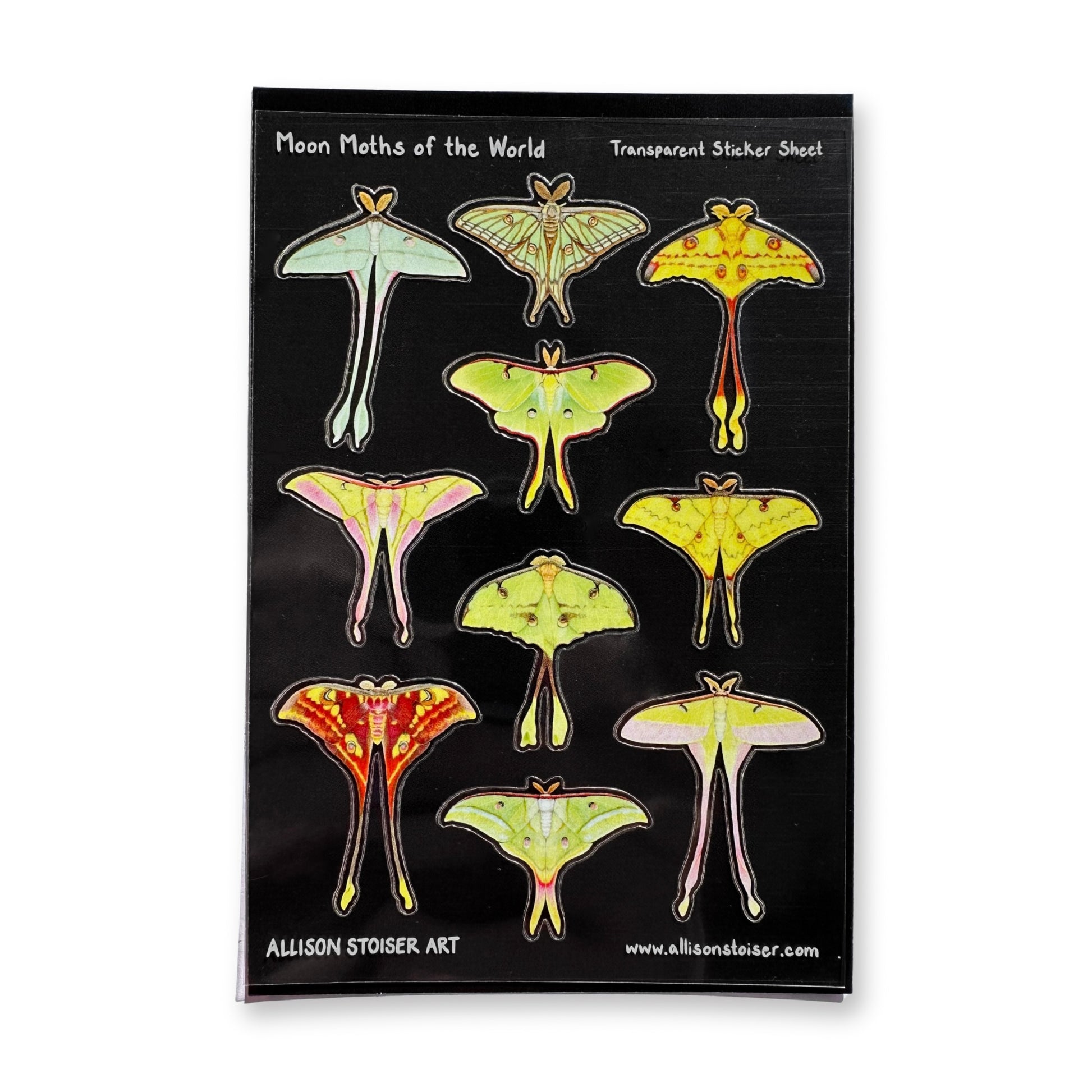 Transparent sticker sheet with moon moth illustrations on a black background
