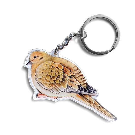 A keychain featuring an illustration of a mourning dove