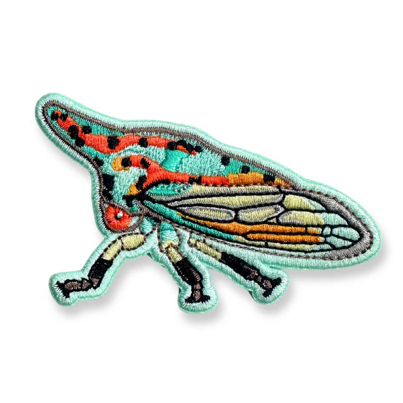 An embroidered patch of an oak treehopper with a mint green border and body, featuring red, orange, black, and gray details on its wings and body, shown on a white background.