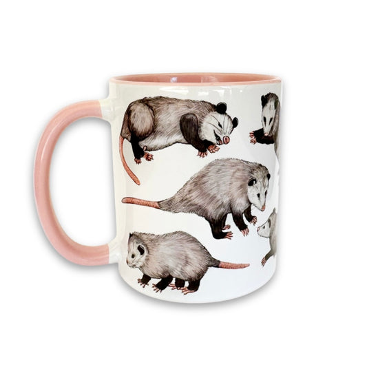 Mug with illustrations of opossums on a white background