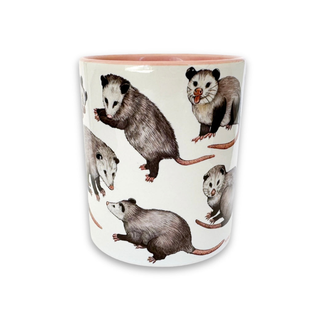Mug with opossum illustrations on a white background