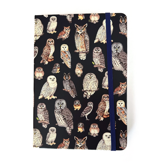 Notebook with owl pattern on a black background
