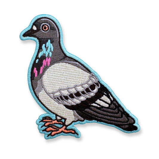 Embroidered patch of a pigeon on a white background