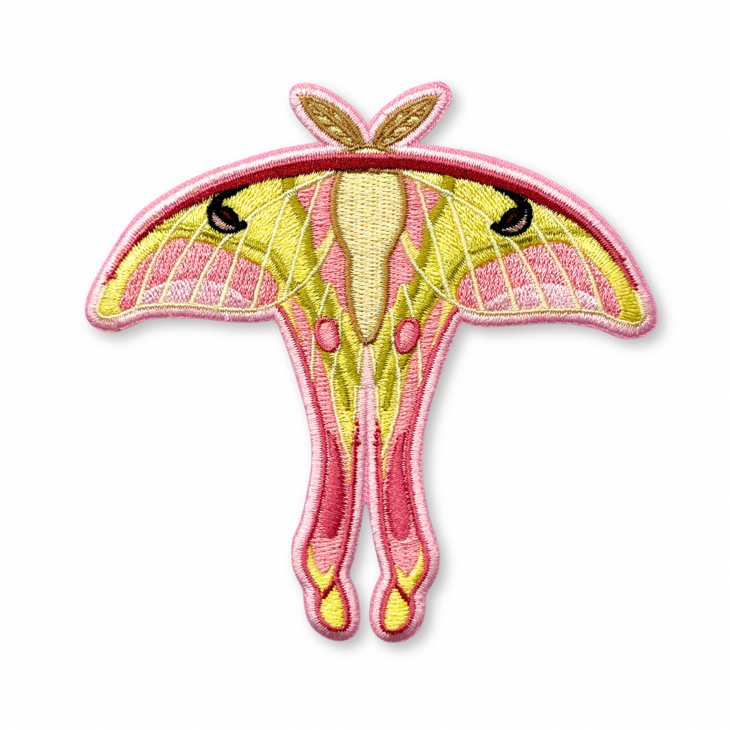 Embroidered patch of a pink spirit moth on a white background