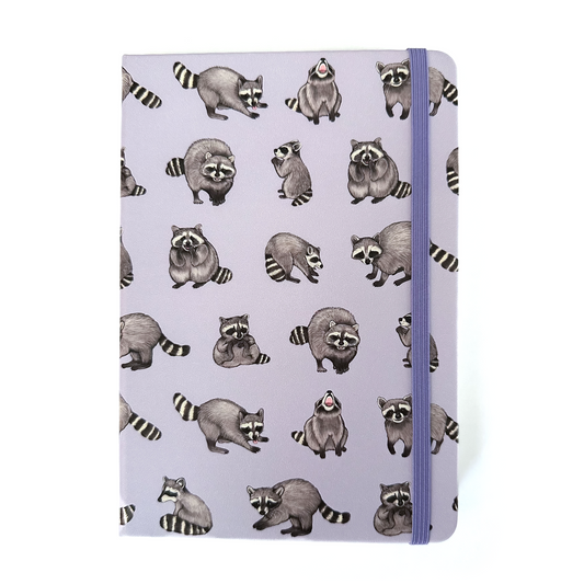 Notebook with raccoon pattern on a white background