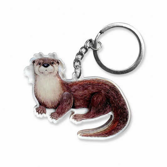 An acrylic keychain featuring a river otter on a plain white background.