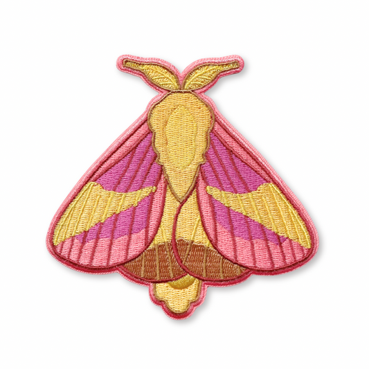 Embroidered patch of a rosy maple moth on a white background