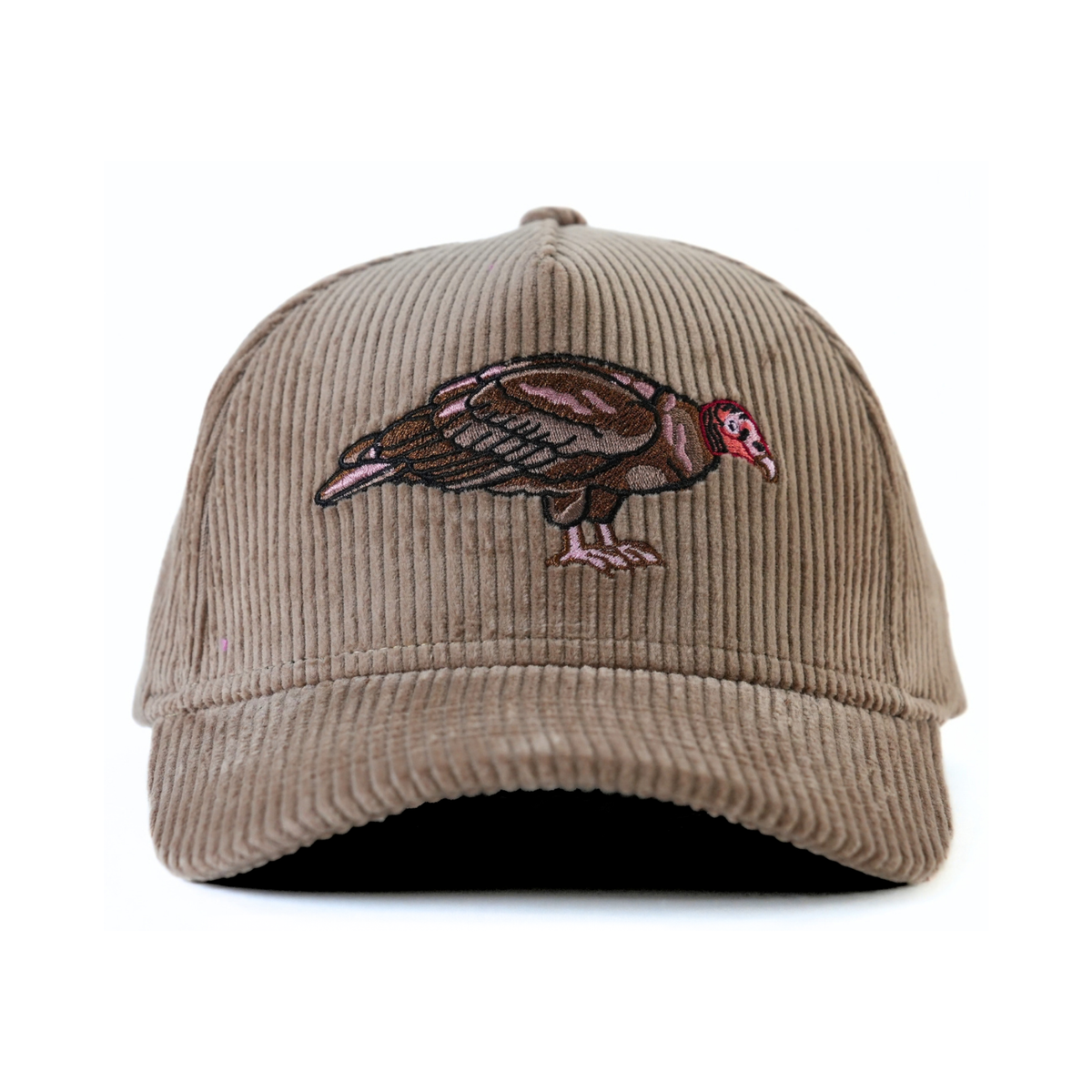 The front of a brown corduroy baseball cap with an embroidered turkey vulture on a white background.