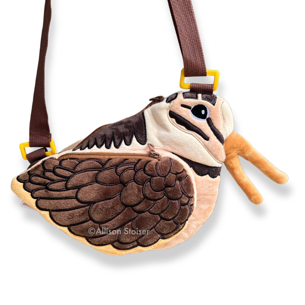 A side view of a plush woodcock bag.