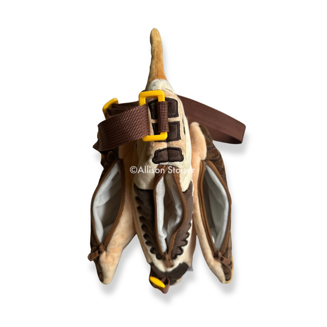 A top-down view of a woodcock bag with zippers open.