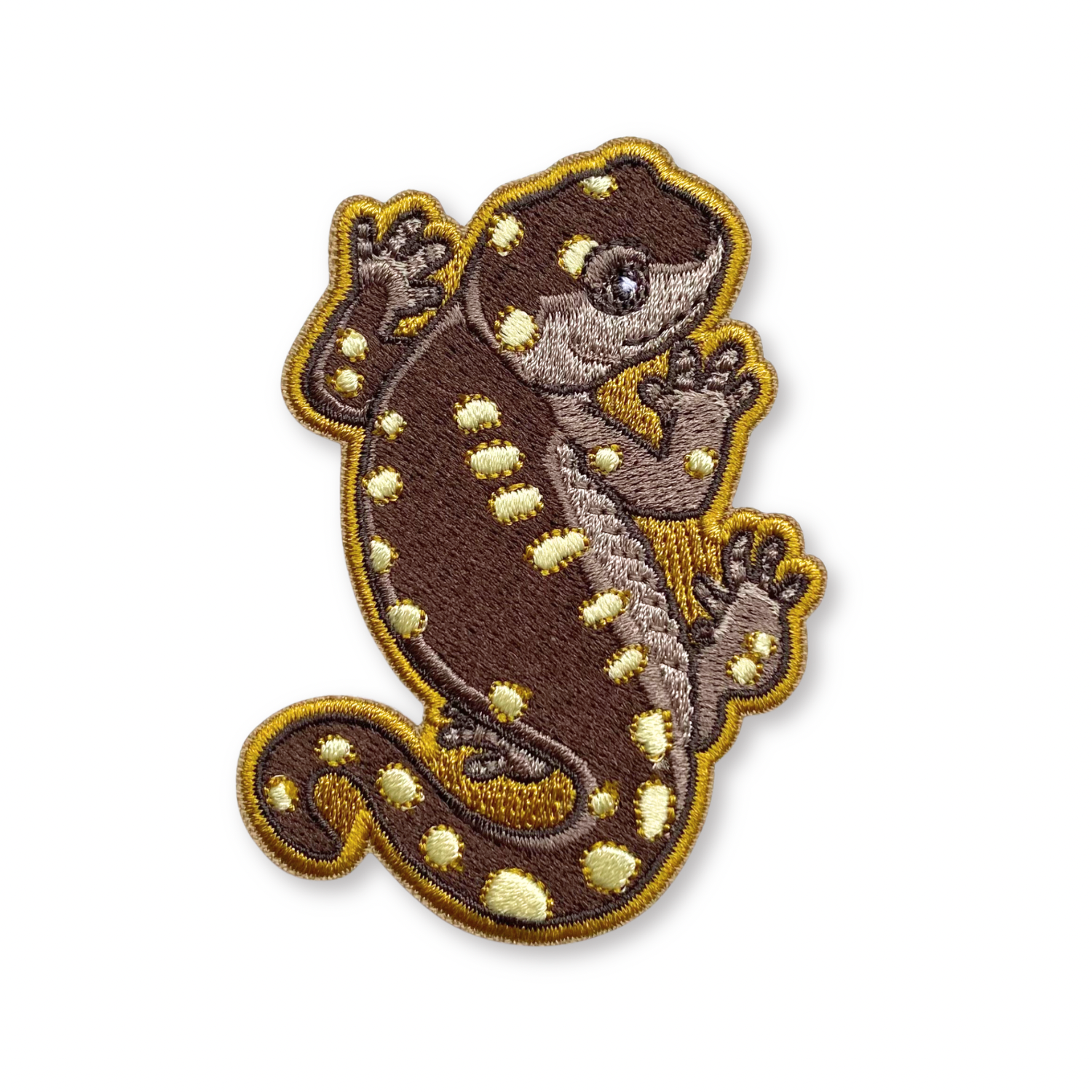 Embroidered patch of a yellow-spotted salamander on a white background