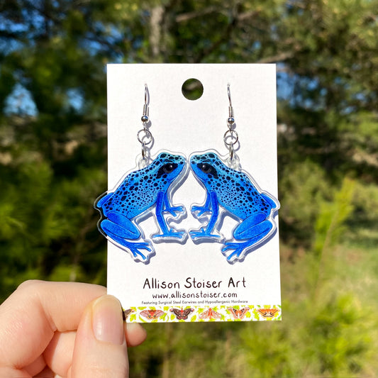 acrylic earrings with blue poison dart frog charms