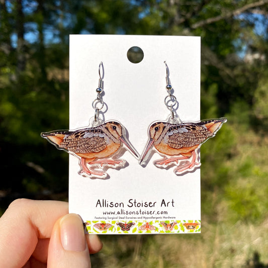 acrylic earrings with woodcock charms