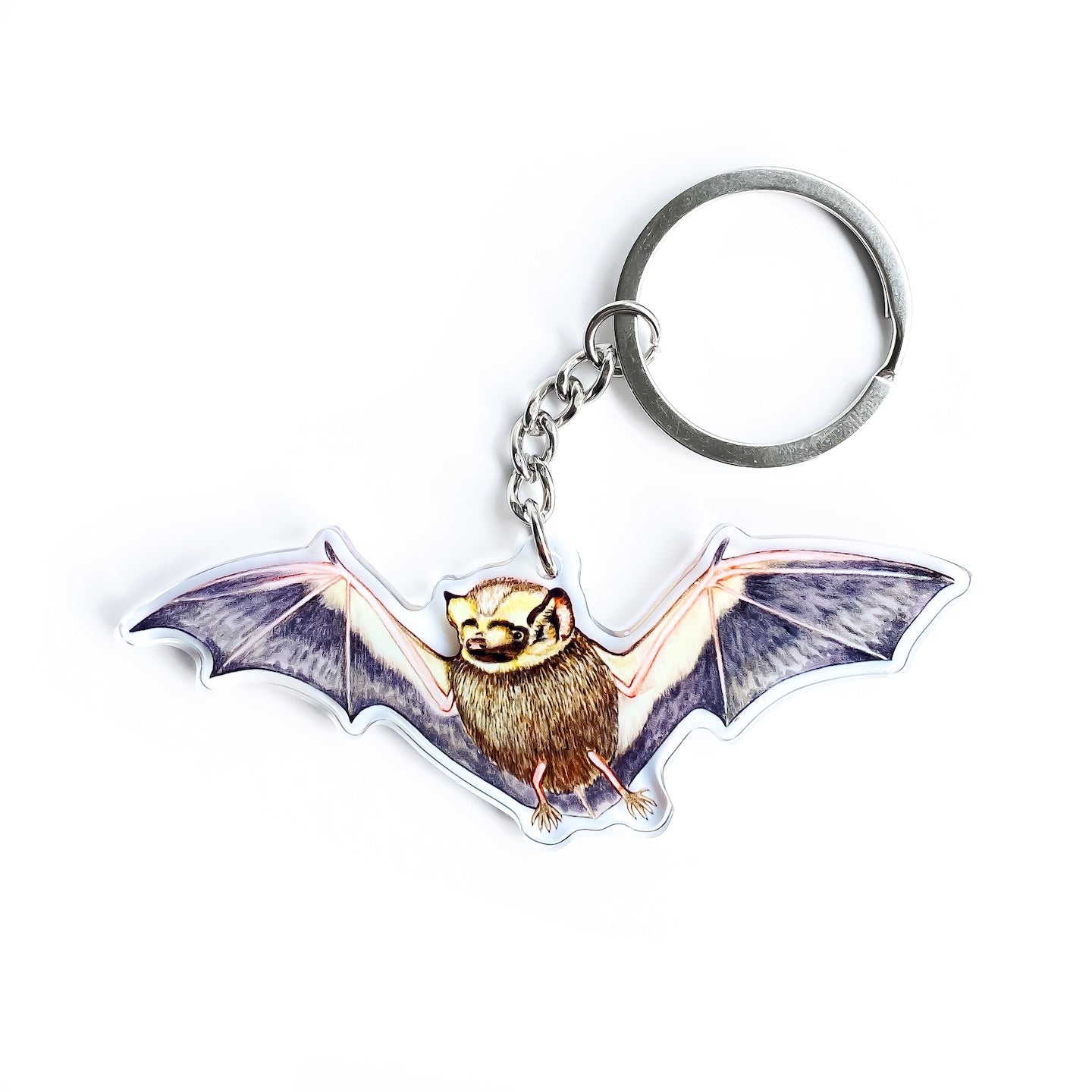 A keychain of a hoary bat on a white background.