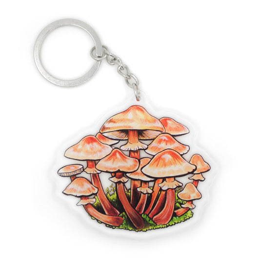 A keychain featuring a honey mushroom