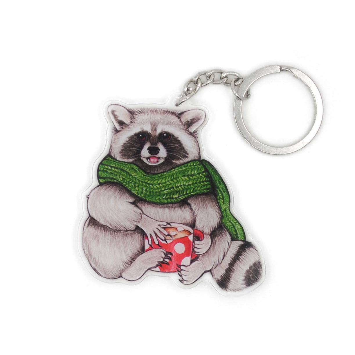 A keychain of a raccoon in a scarf with a mug of hot chocolate on a white background.