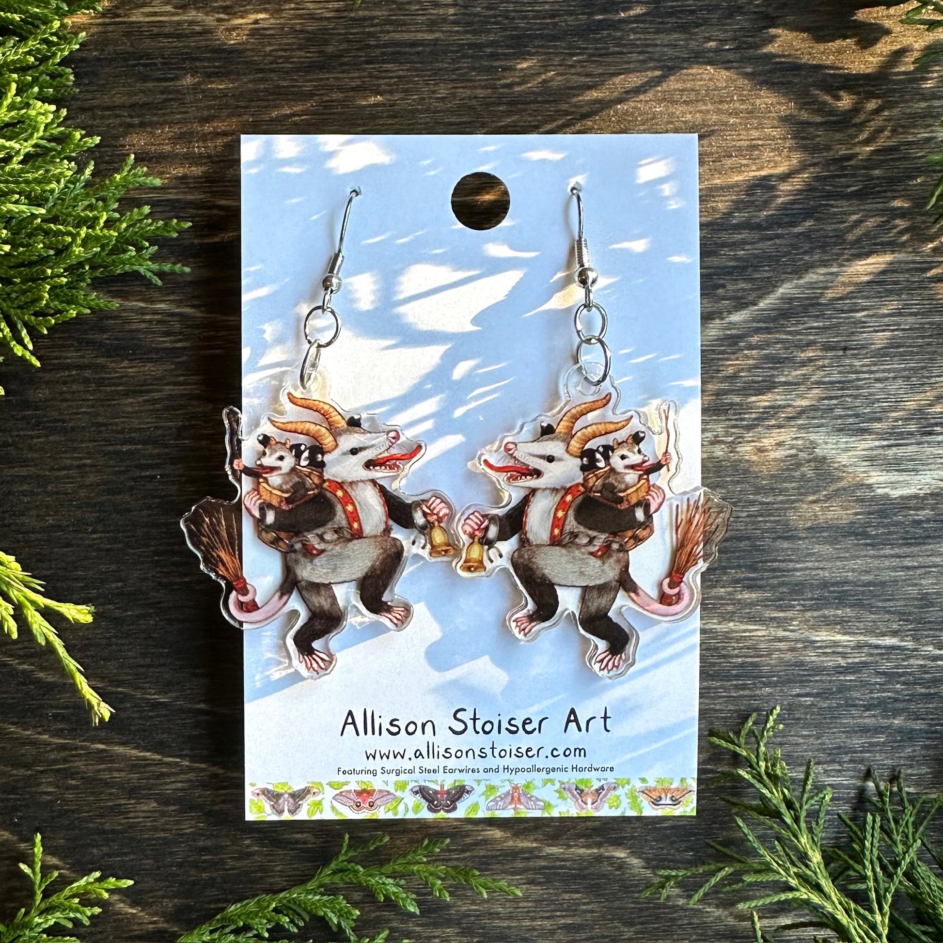 acrylic earrings with krampus opossum charms