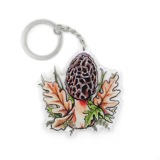 A keychain of a morel mushroom on a white background.