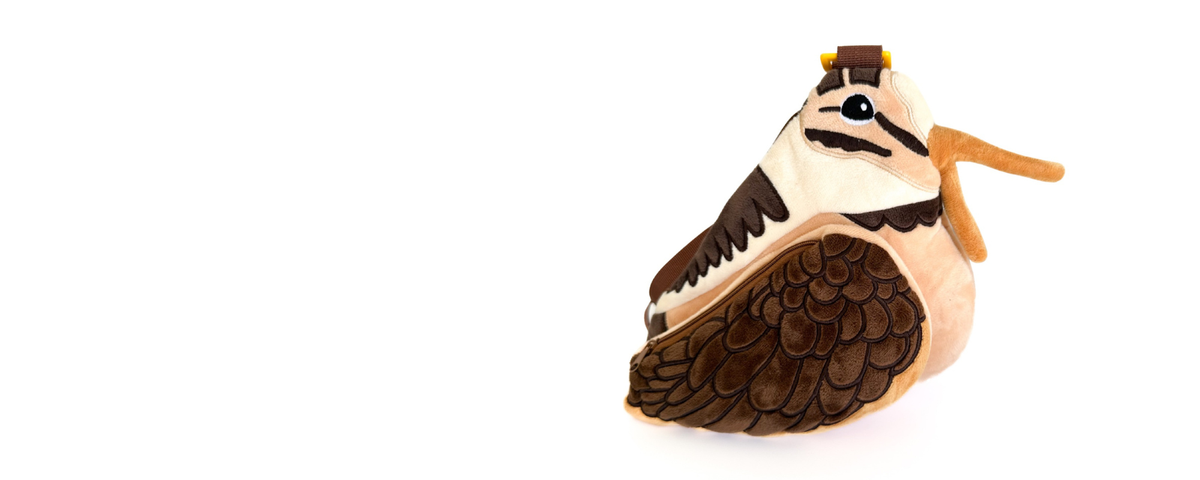 a plush woodcock bag on a white background