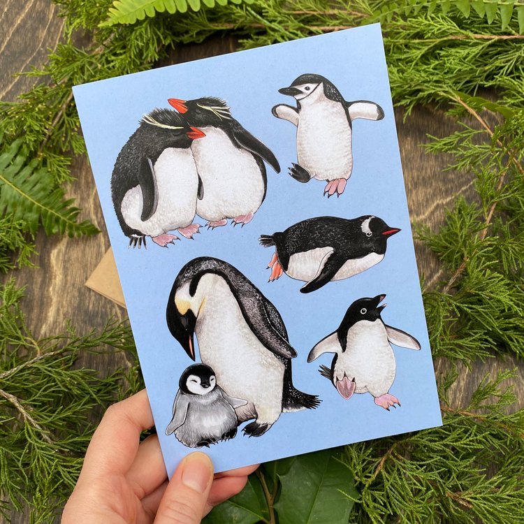 A folding card featuring a series of penguin illustrations