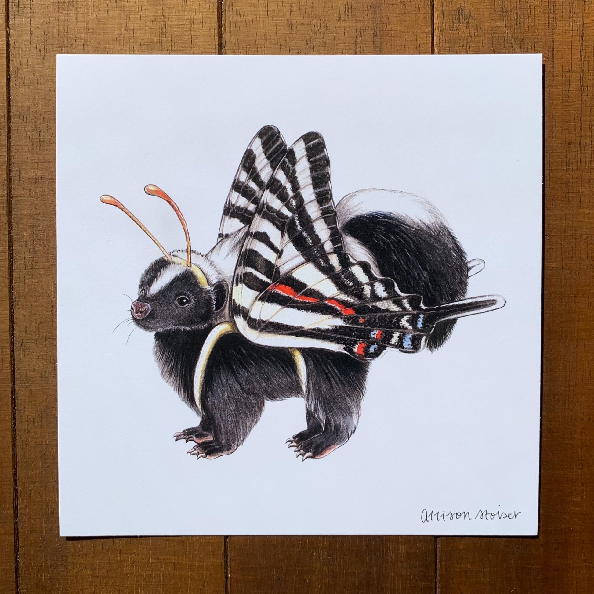 A print featuring an illustration of a skunk dressed as a zebra swallowtail