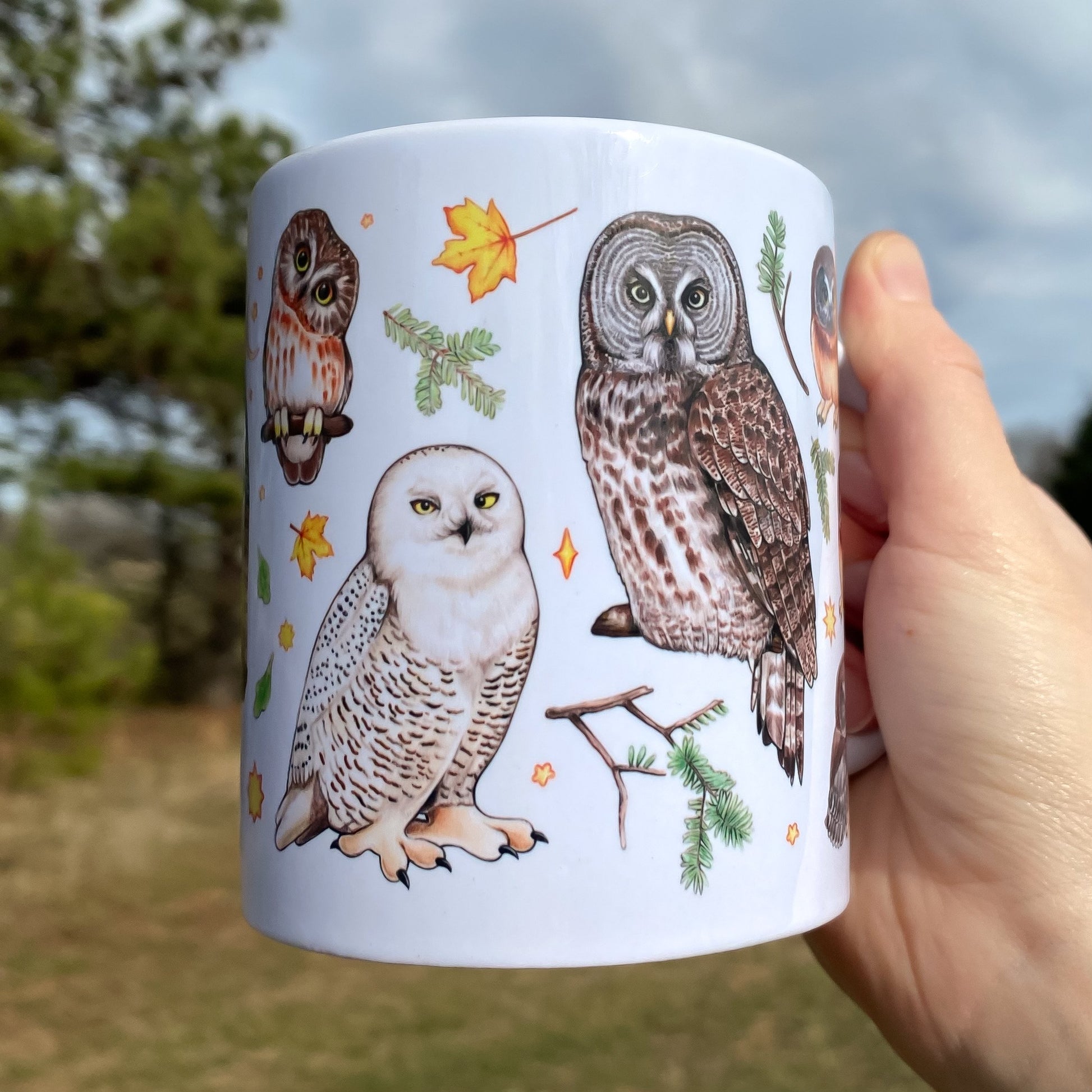 A mug featuring owls of the eastern united states