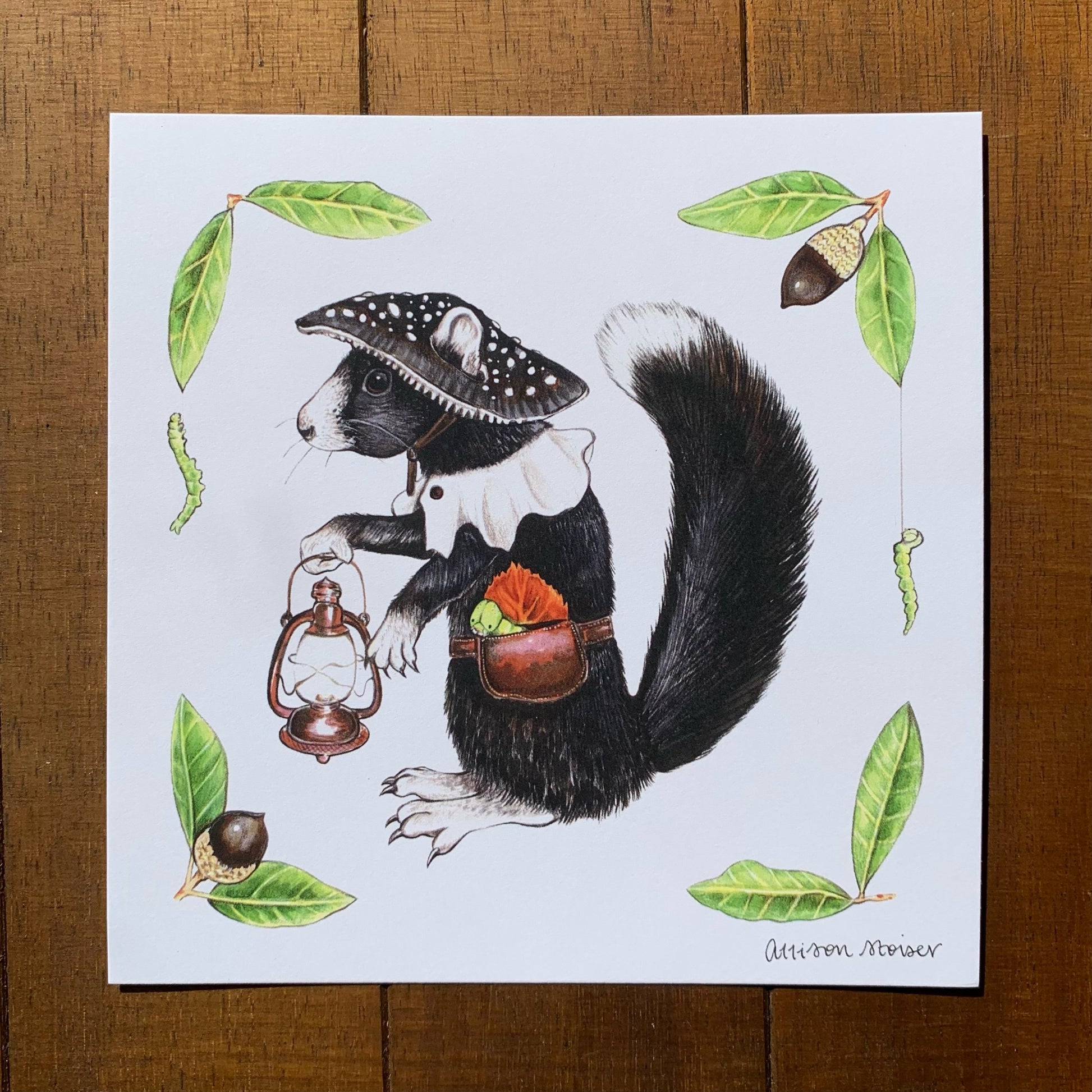 A print featuring an illustration of a black fox squirrel wearing a mushroom hat and carrying lantern