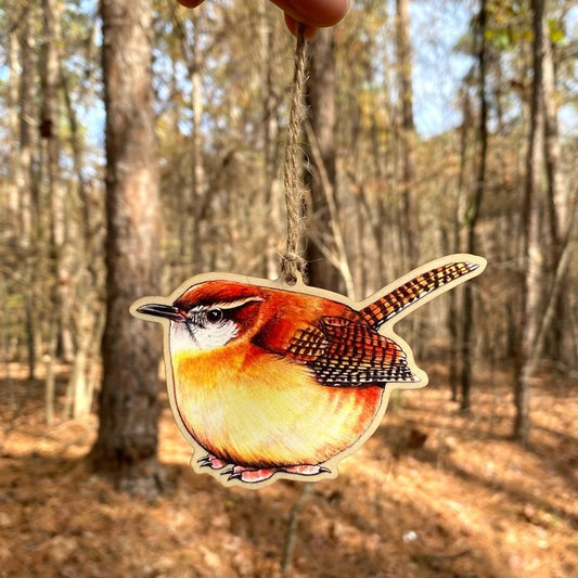 A wood print ornament featuring an illustration of a Carolina wrench 