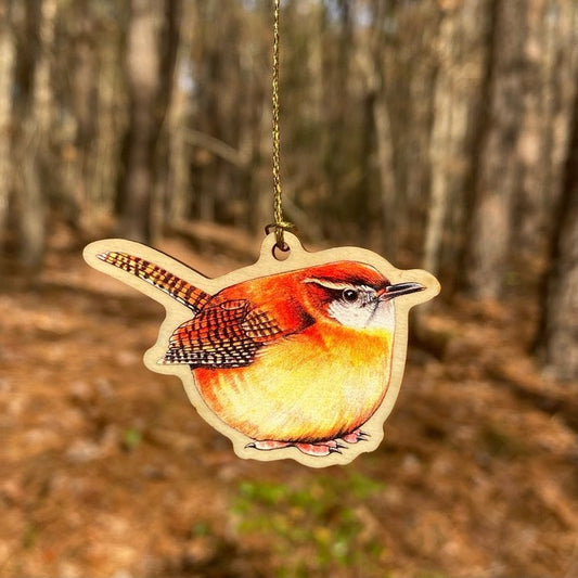 A wood print ornament featuring an illustration of a Carolina wren