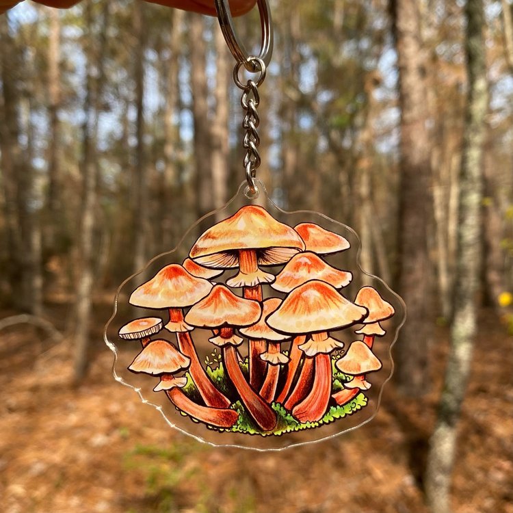 A keychain featuring a honey mushroom